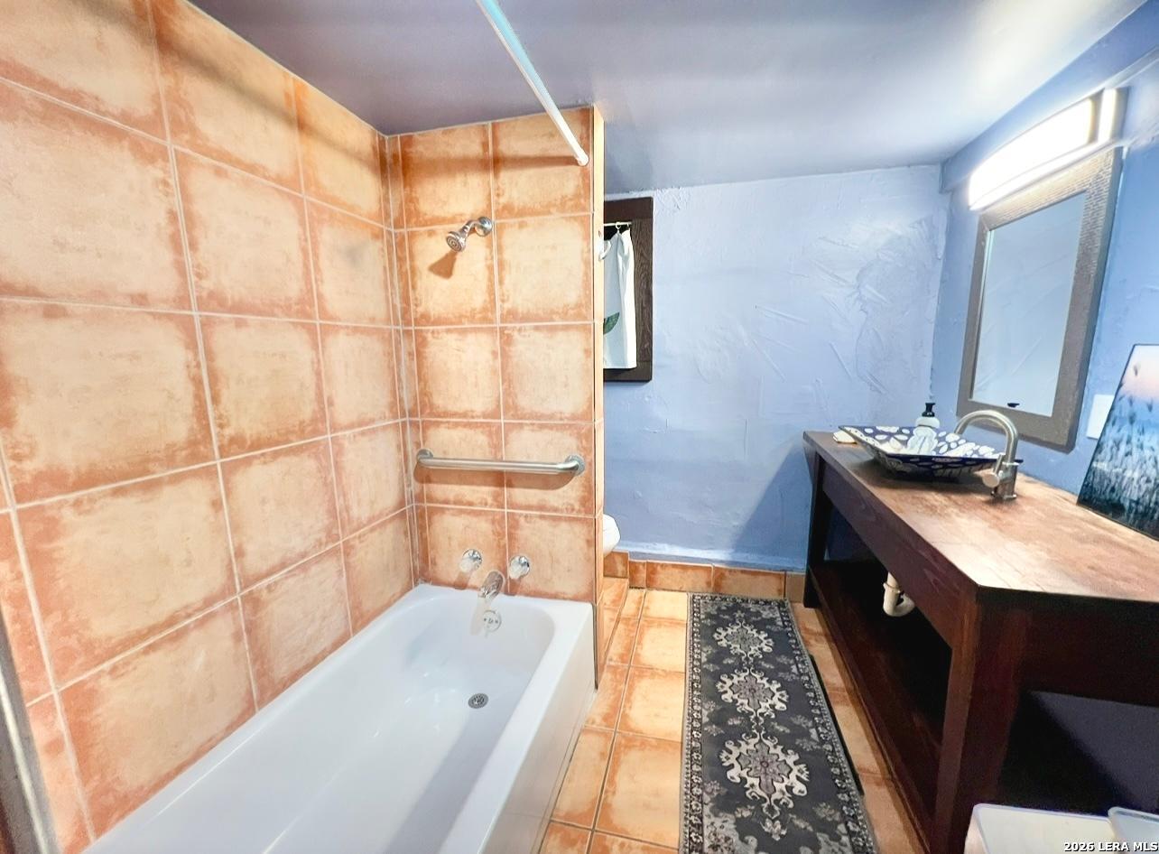 299 Fort Clark Road Brackettville, TX 78832 - Photo 16 of 50 a bathroom with a sink a toilet and shower