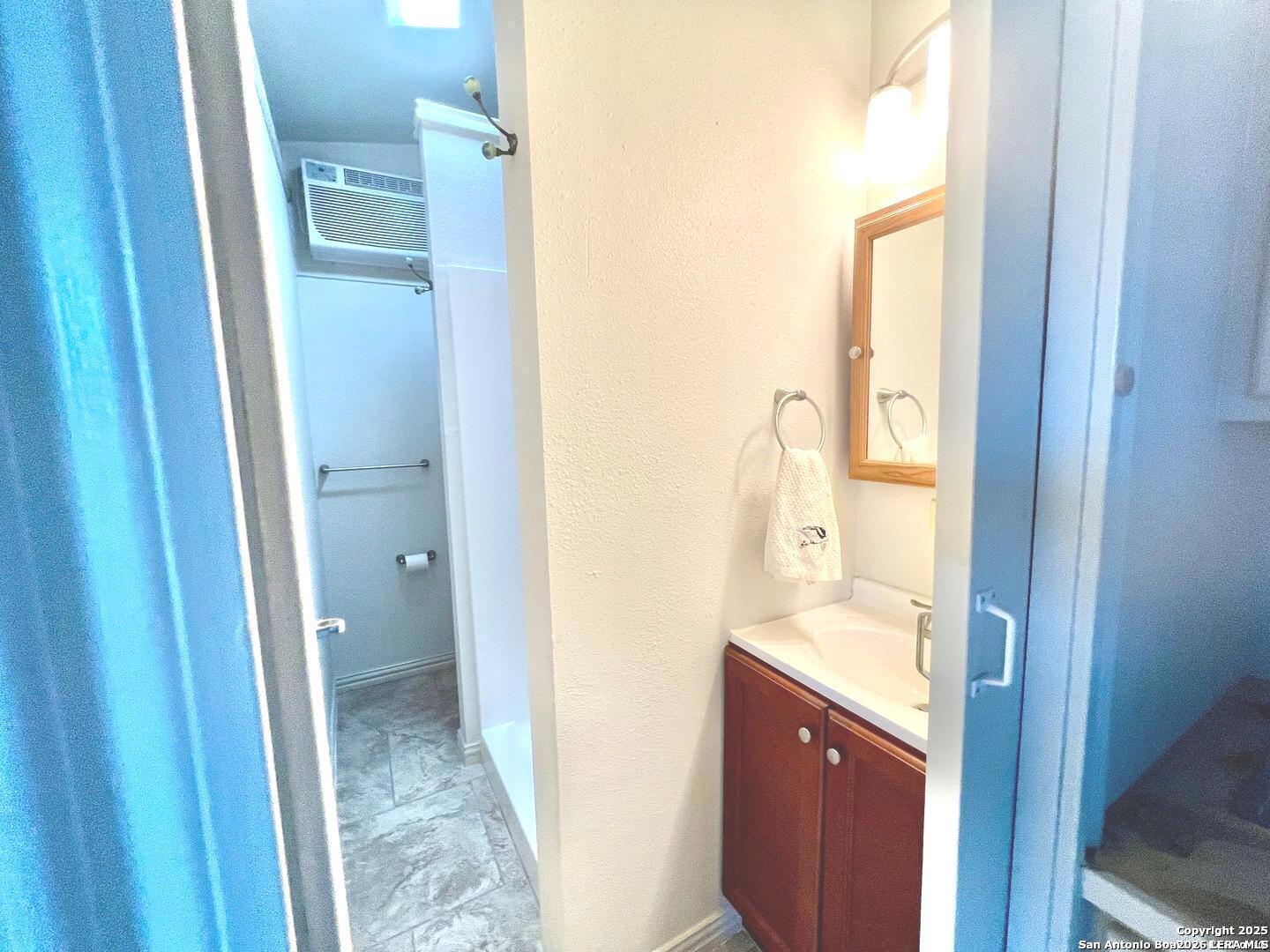 299 Fort Clark Road Brackettville, TX 78832 - Photo 30 of 50 a bathroom with a sink and mirror with toilet
