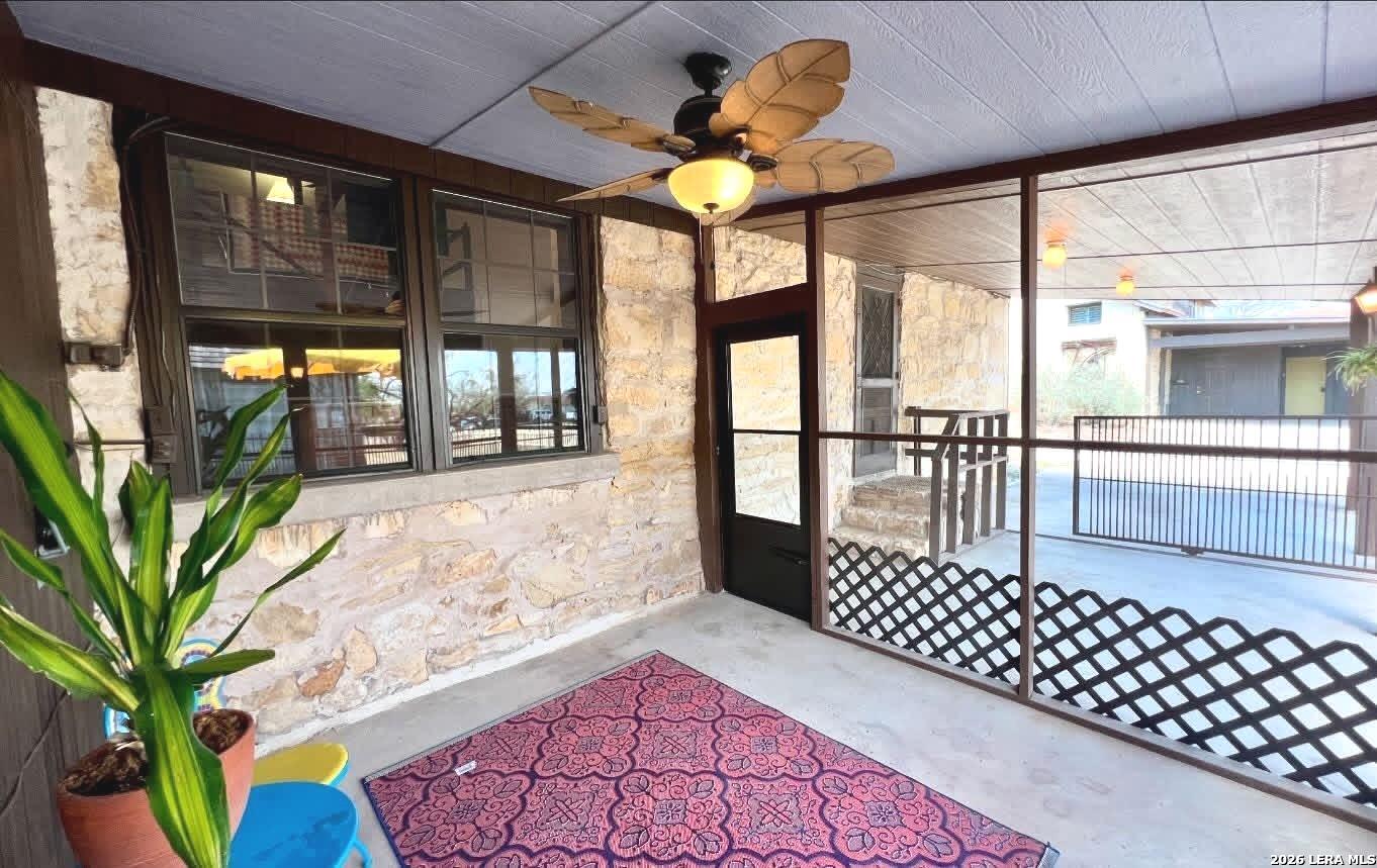 299 Fort Clark Road Brackettville, TX 78832 - Photo 36 of 50 a porch with a table and chairs