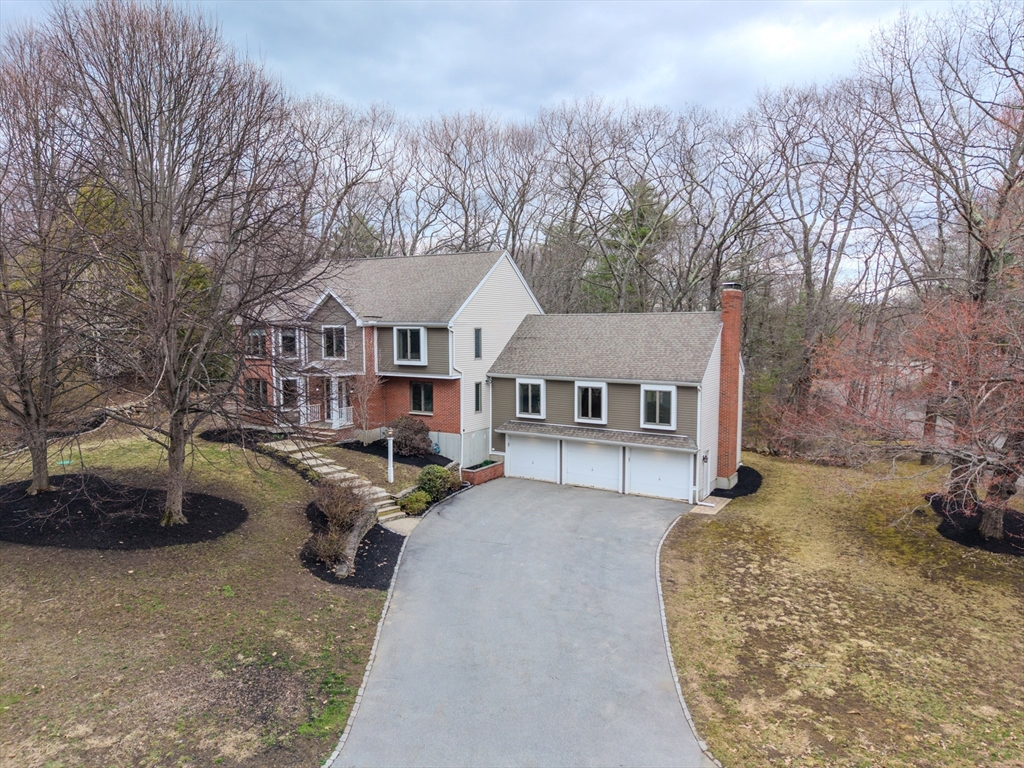 315 Candlestick Road North Andover, MA 01845 - Photo 2 of 42 a view of a house with a couches in a patio