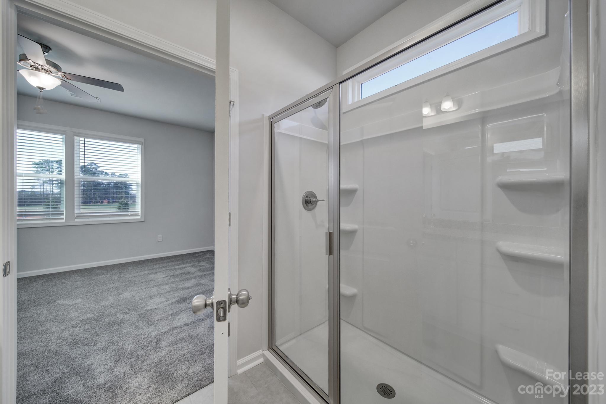 8201 Mccormick Street Terrell, NC 28682 - Photo 22 of 28 a bathroom with a glass shower door