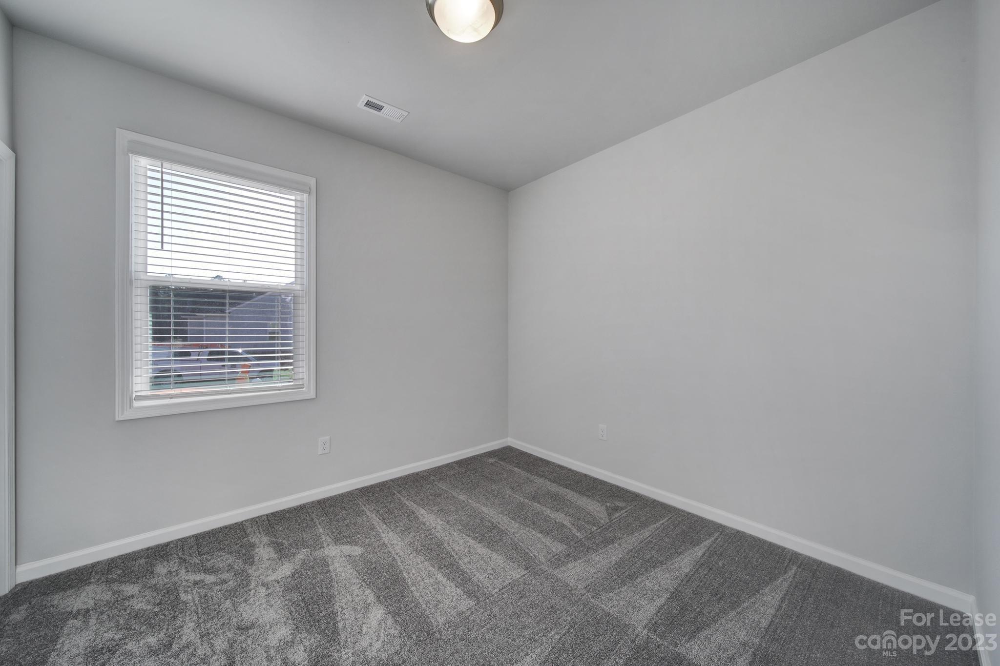 8201 Mccormick Street Terrell, NC 28682 - Photo 5 of 28 an empty room with a window