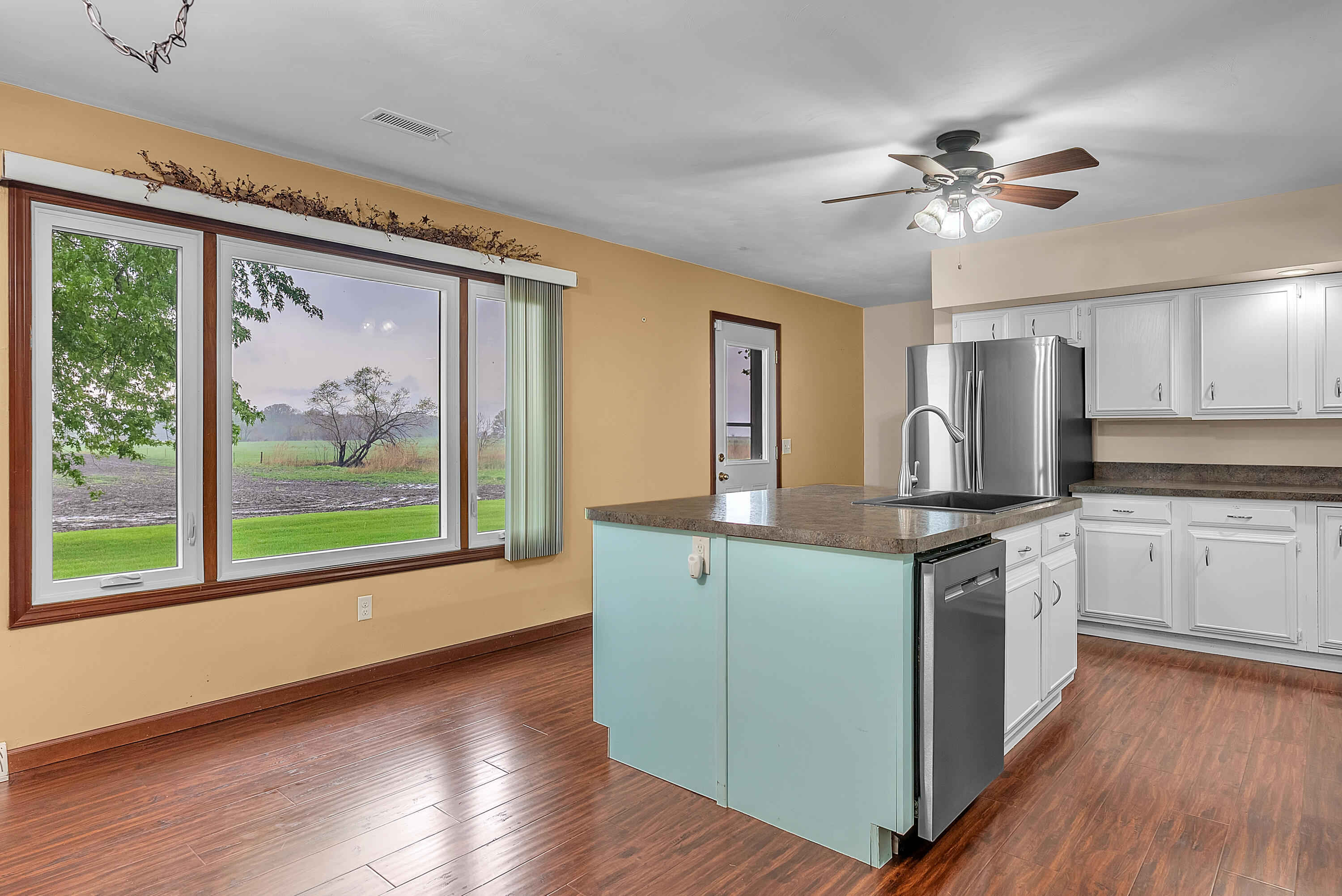 2204 South Meridian Road Morocco, IN 47963 - Photo 11 of 35 a kitchen with stainless steel appliances a stove top oven and a large window