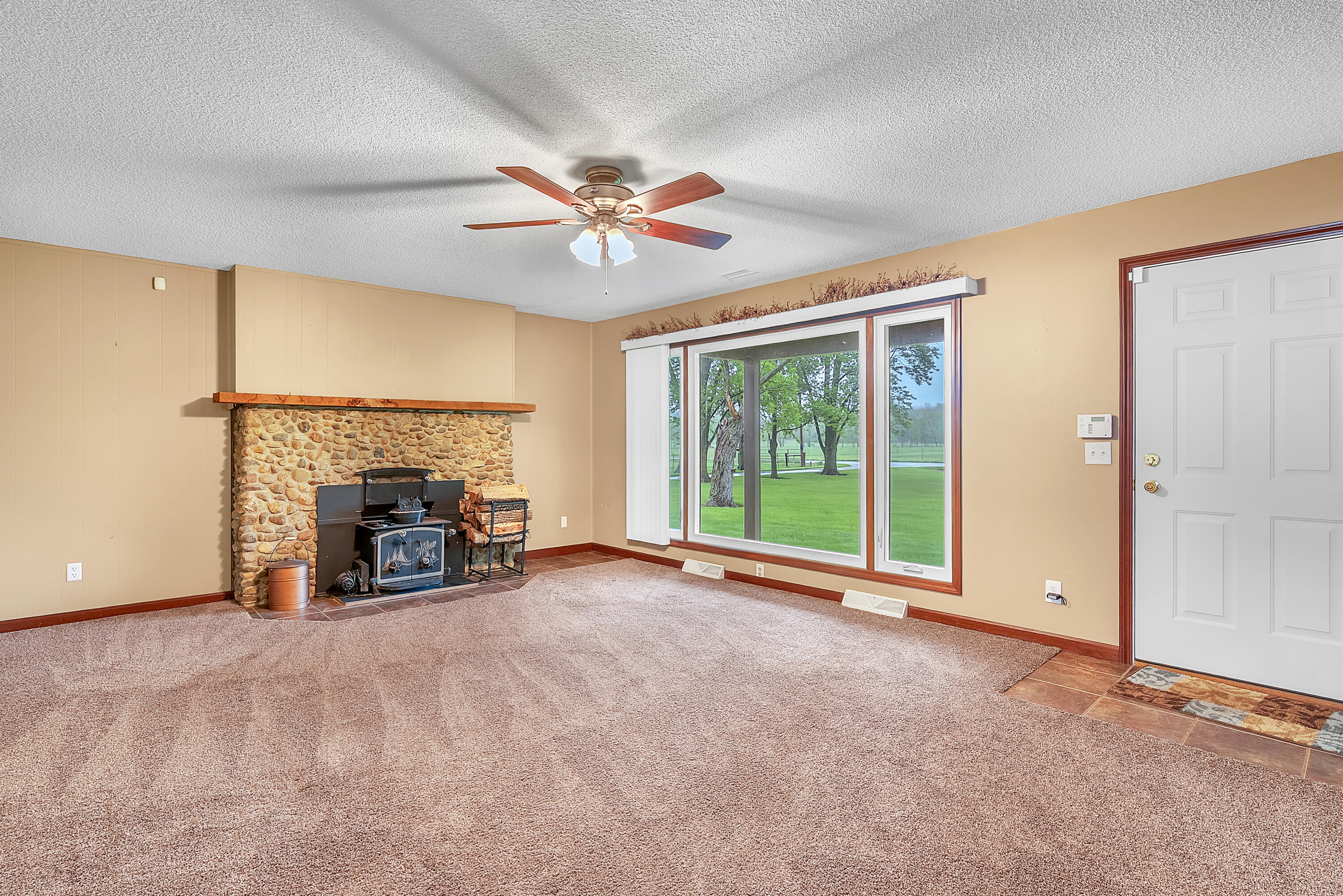 2204 South Meridian Road Morocco, IN 47963 - Photo 13 of 35 a view of an empty room with furniture and a fireplace