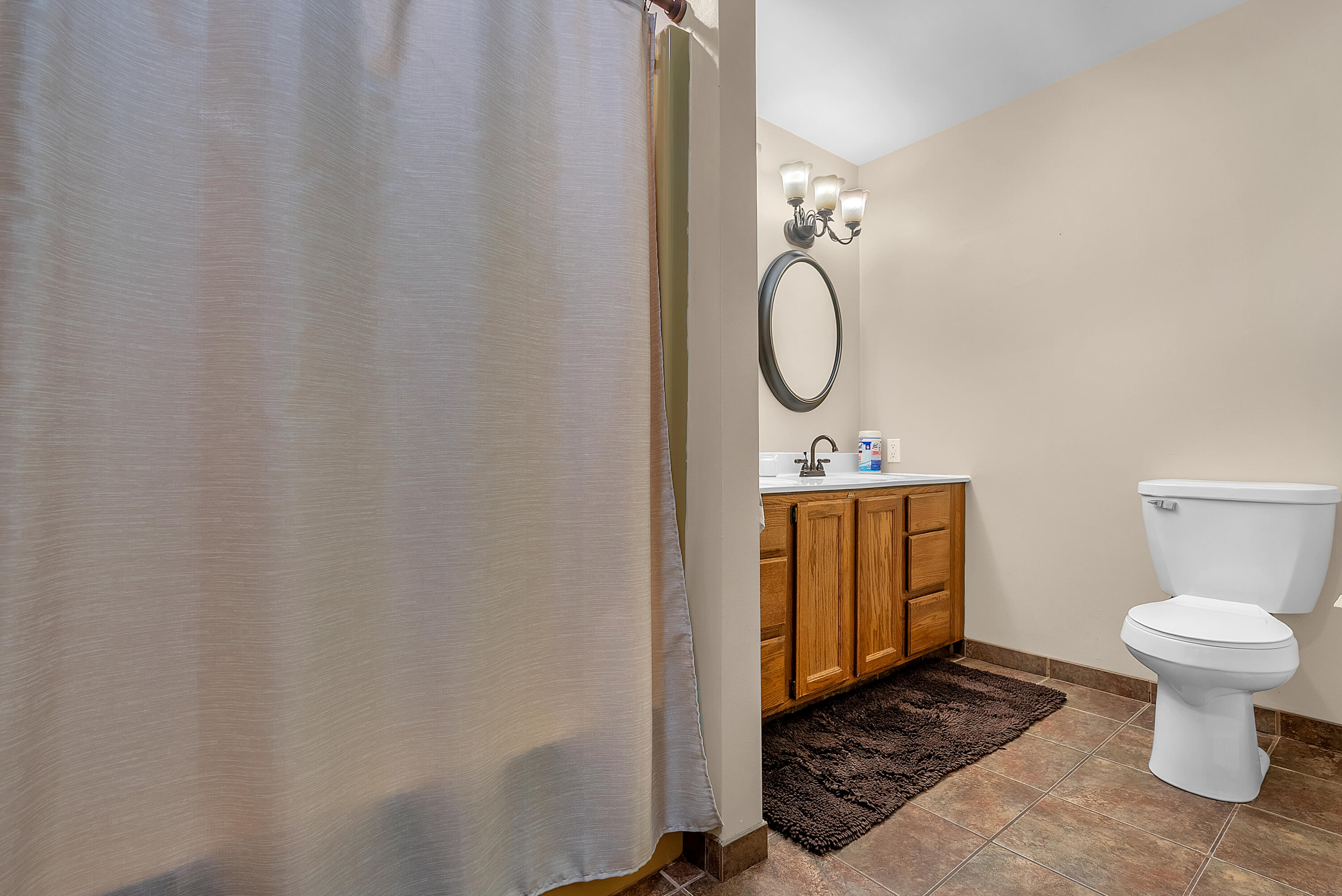 2204 South Meridian Road Morocco, IN 47963 - Photo 18 of 35 a bathroom with a toilet sink and mirror