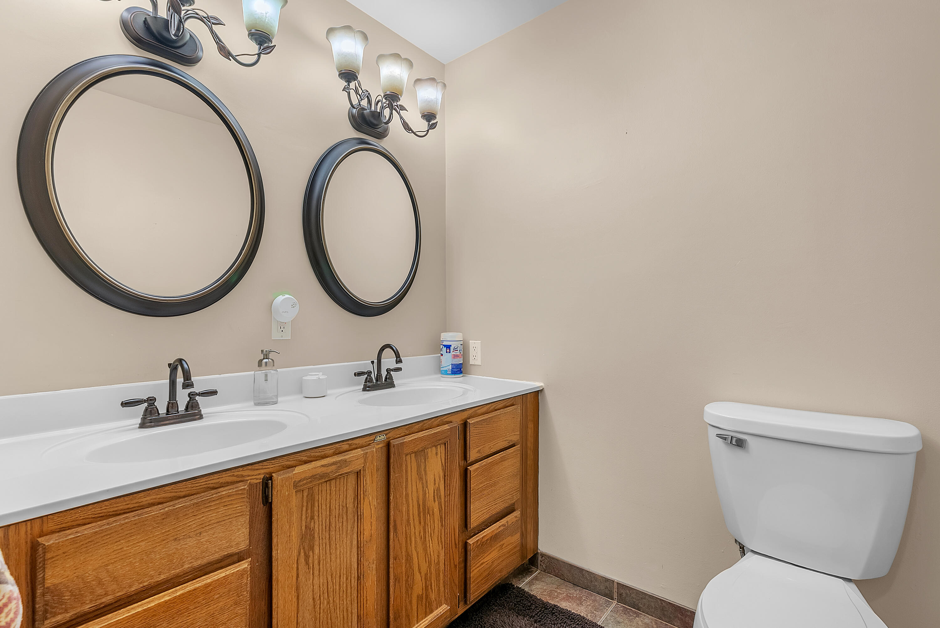 2204 South Meridian Road Morocco, IN 47963 - Photo 19 of 35 a bathroom with a toilet a sink and a mirror
