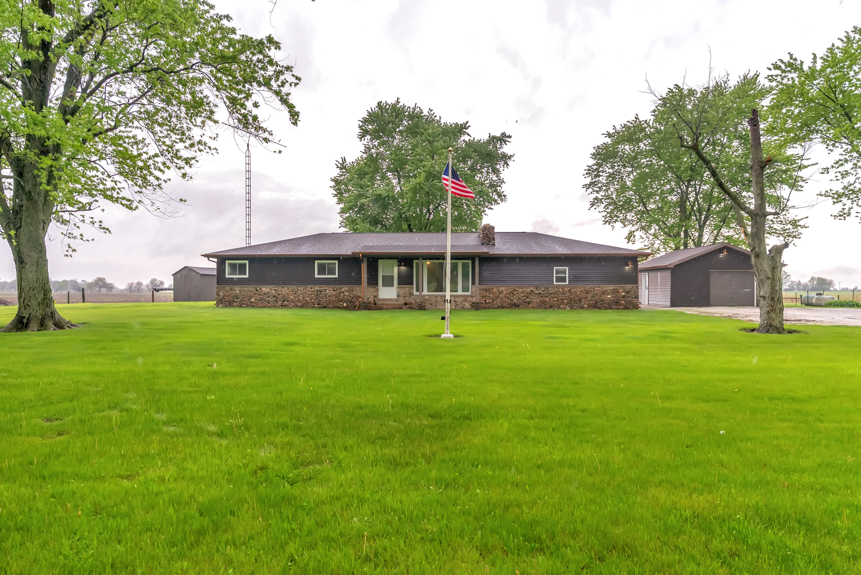 2204 South Meridian Road Morocco, IN 47963 - Photo 2 of 35 a front view of house with a garden