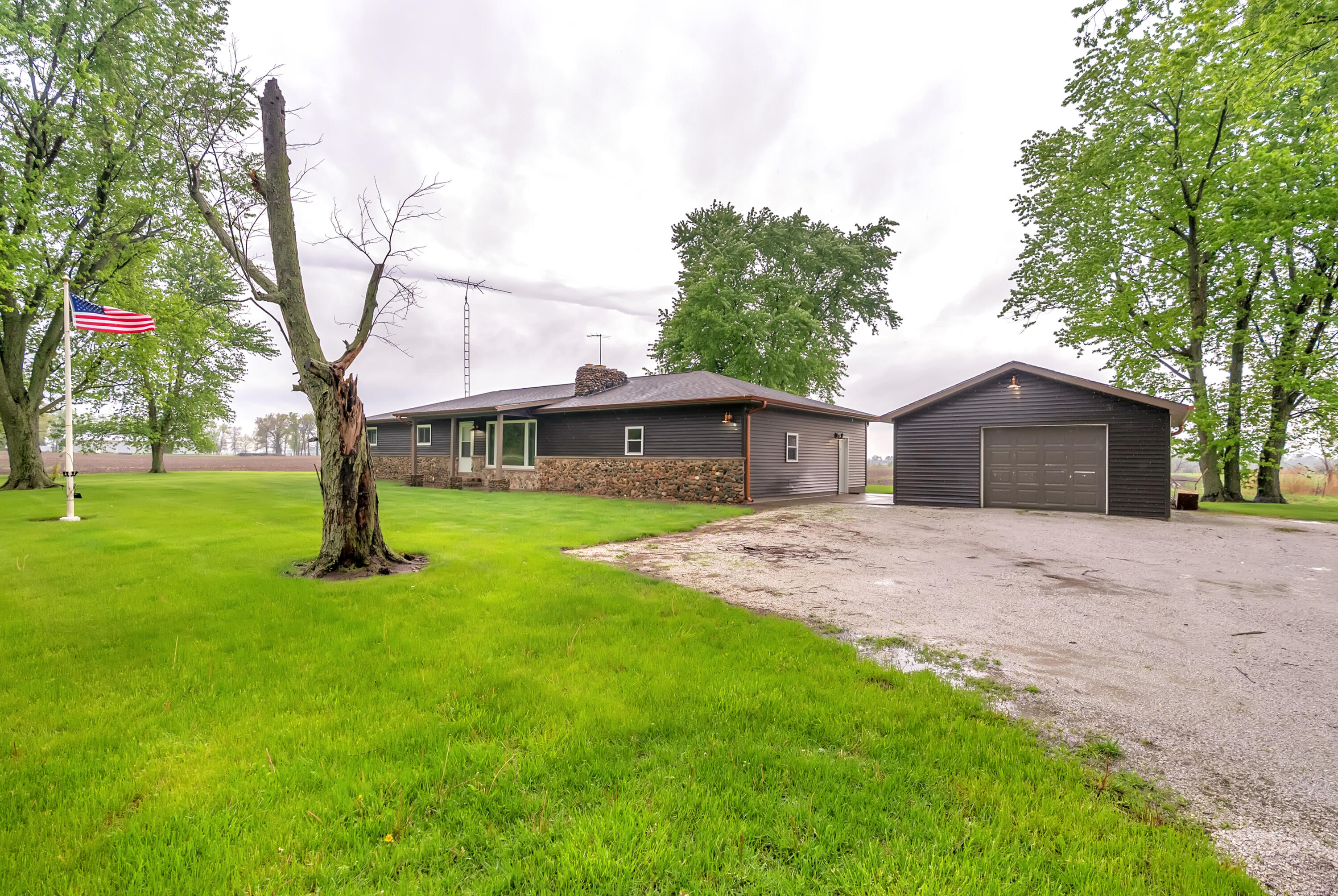 2204 South Meridian Road Morocco, IN 47963 - Photo 32 of 35 a front view of a house with a garden and trees
