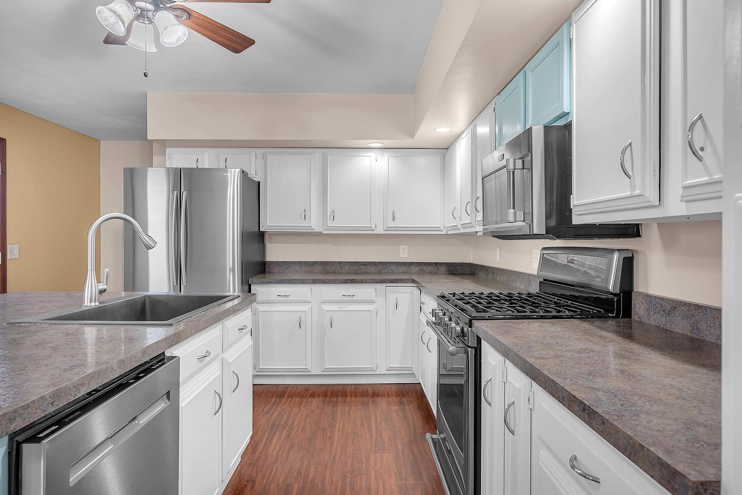 2204 South Meridian Road Morocco, IN 47963 - Photo 6 of 35 a kitchen with stainless steel appliances granite countertop a sink stove and refrigerator