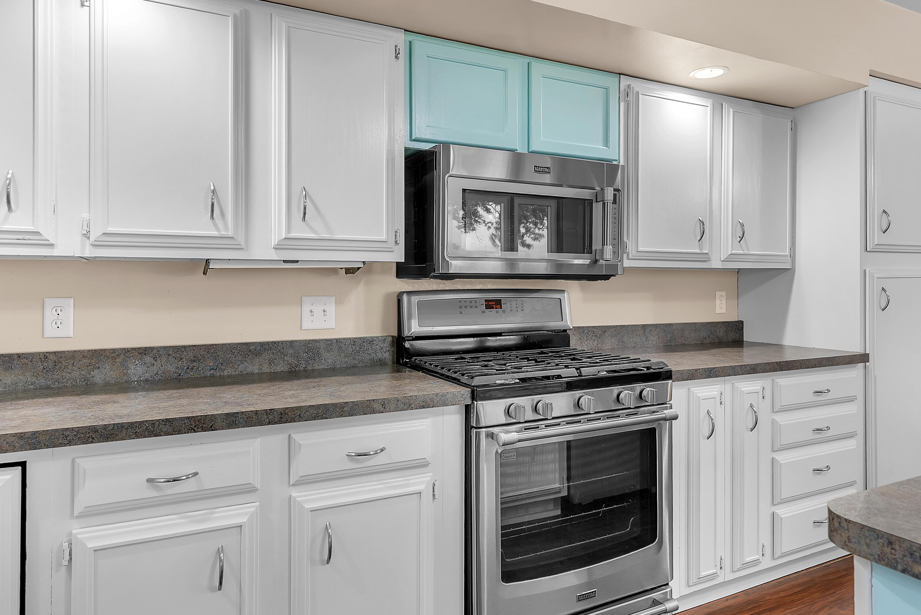 2204 South Meridian Road Morocco, IN 47963 - Photo 7 of 35 a kitchen with granite countertop white cabinets and stainless steel appliances