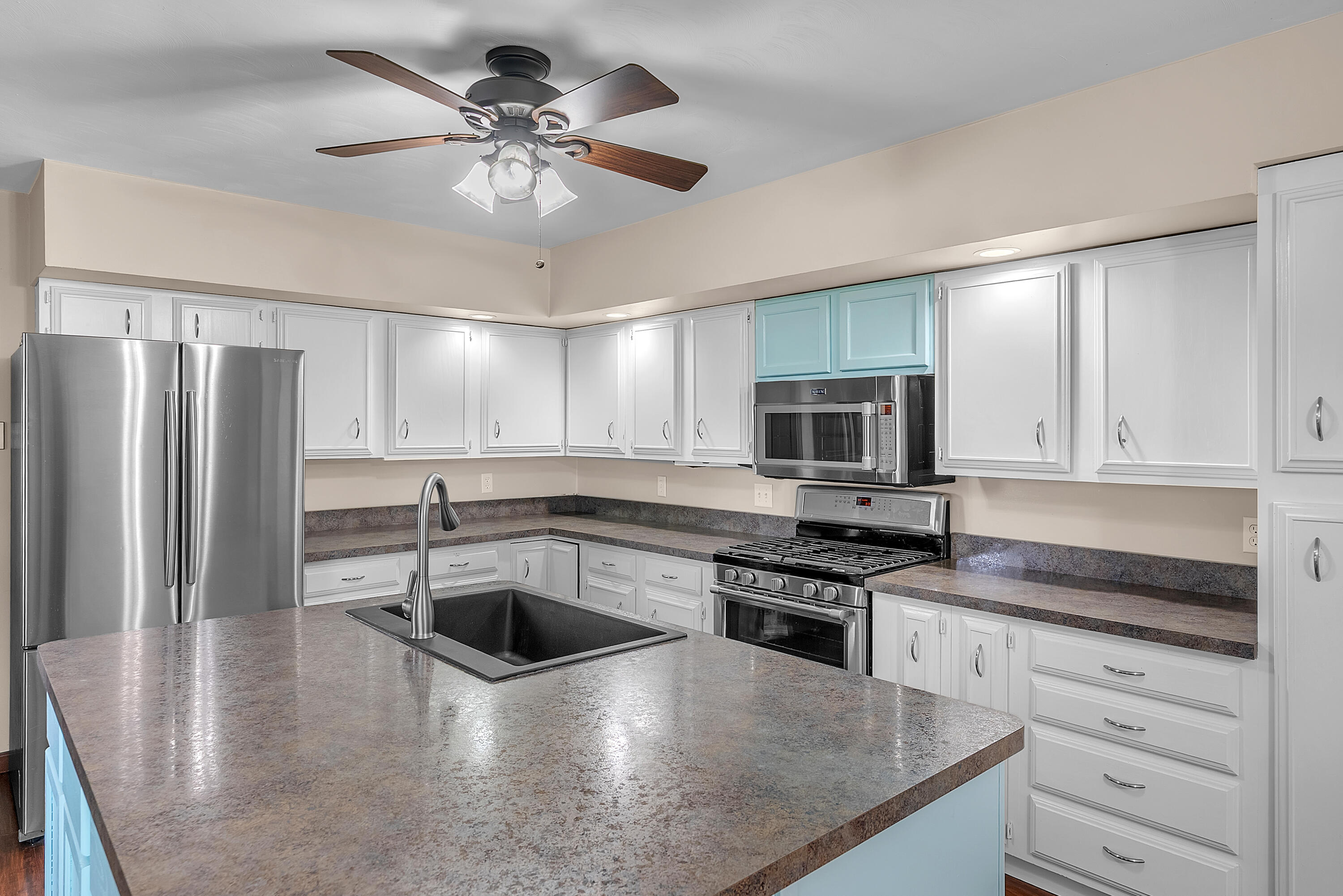 2204 South Meridian Road Morocco, IN 47963 - Photo 8 of 35 a kitchen with stainless steel appliances granite countertop a sink a stove and a refrigerator
