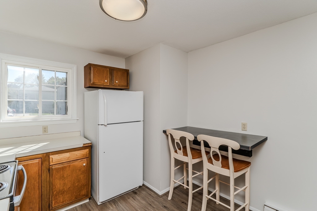 170 East Hadley Road, Unit 46 Amherst, MA 01002 - Photo 13 of 31 a view of a livingroom with furniture and wooden floor