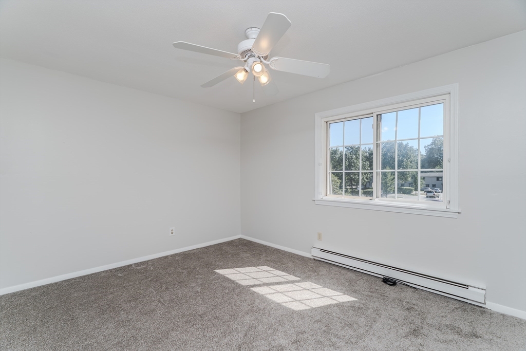 170 East Hadley Road, Unit 46 Amherst, MA 01002 - Photo 17 of 31 an empty room with a window