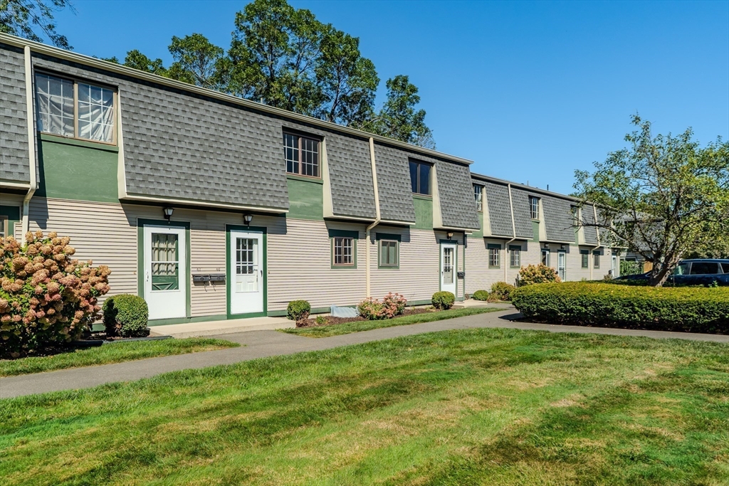 170 East Hadley Road, Unit 46 Amherst, MA 01002 - Photo 5 of 31 a front view of a house with a yard
