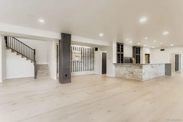 a bathroom with a shower a sink and toilet