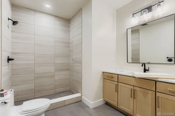 a kitchen with stainless steel appliances kitchen island granite countertop a sink and cabinets
