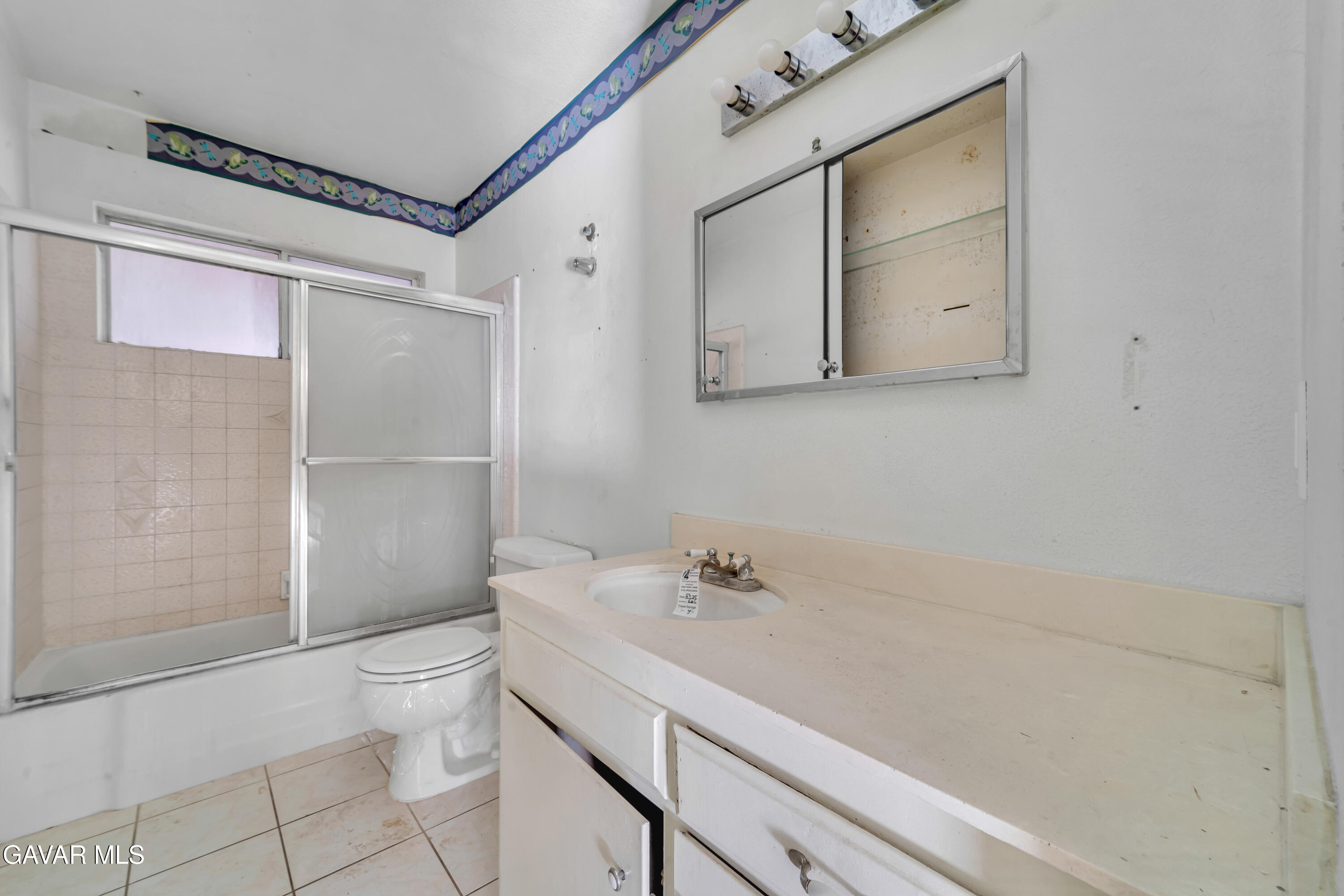 41522 Rimfield Avenue Lancaster, CA 93536 - Photo 11 of 15 a bathroom with a sink a toilet and shower