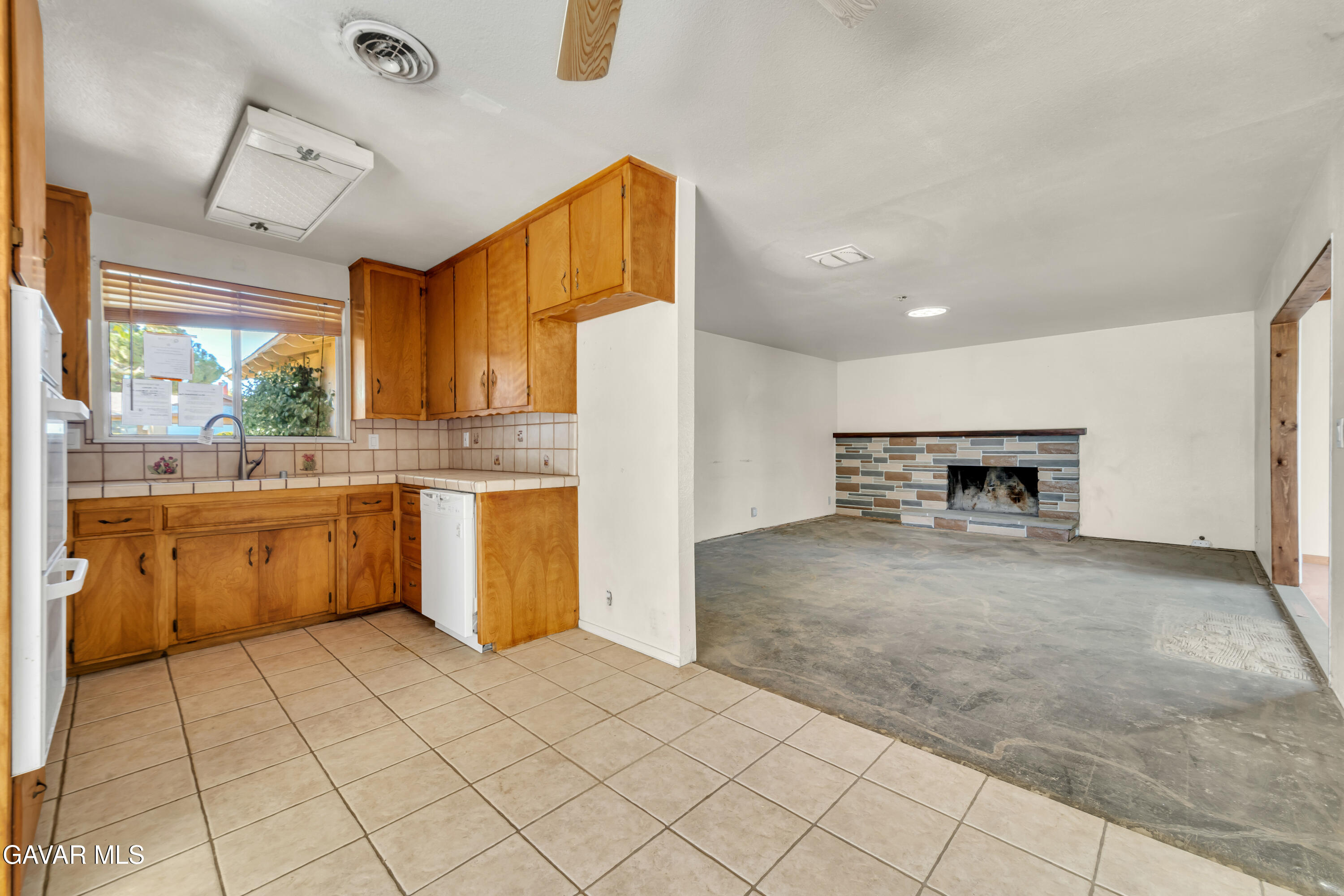41522 Rimfield Avenue Lancaster, CA 93536 - Photo 2 of 15 a kitchen with a sink a stove and a refrigerator