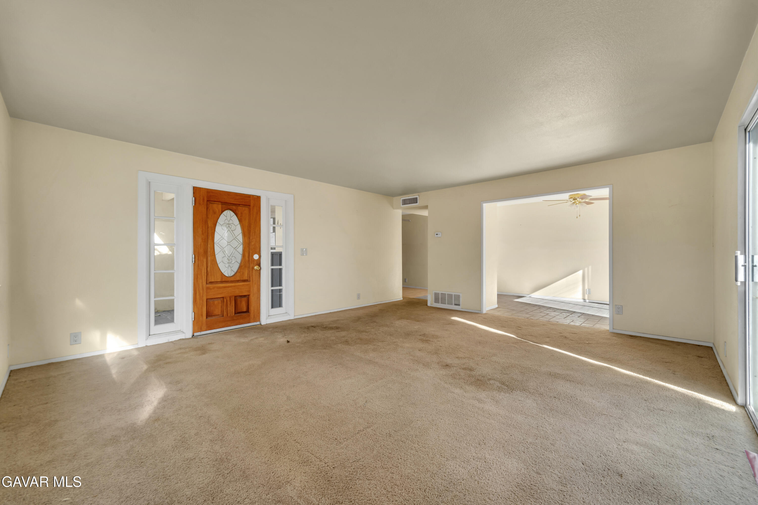 41522 Rimfield Avenue Lancaster, CA 93536 - Photo 6 of 15 a view of a room with a large window
