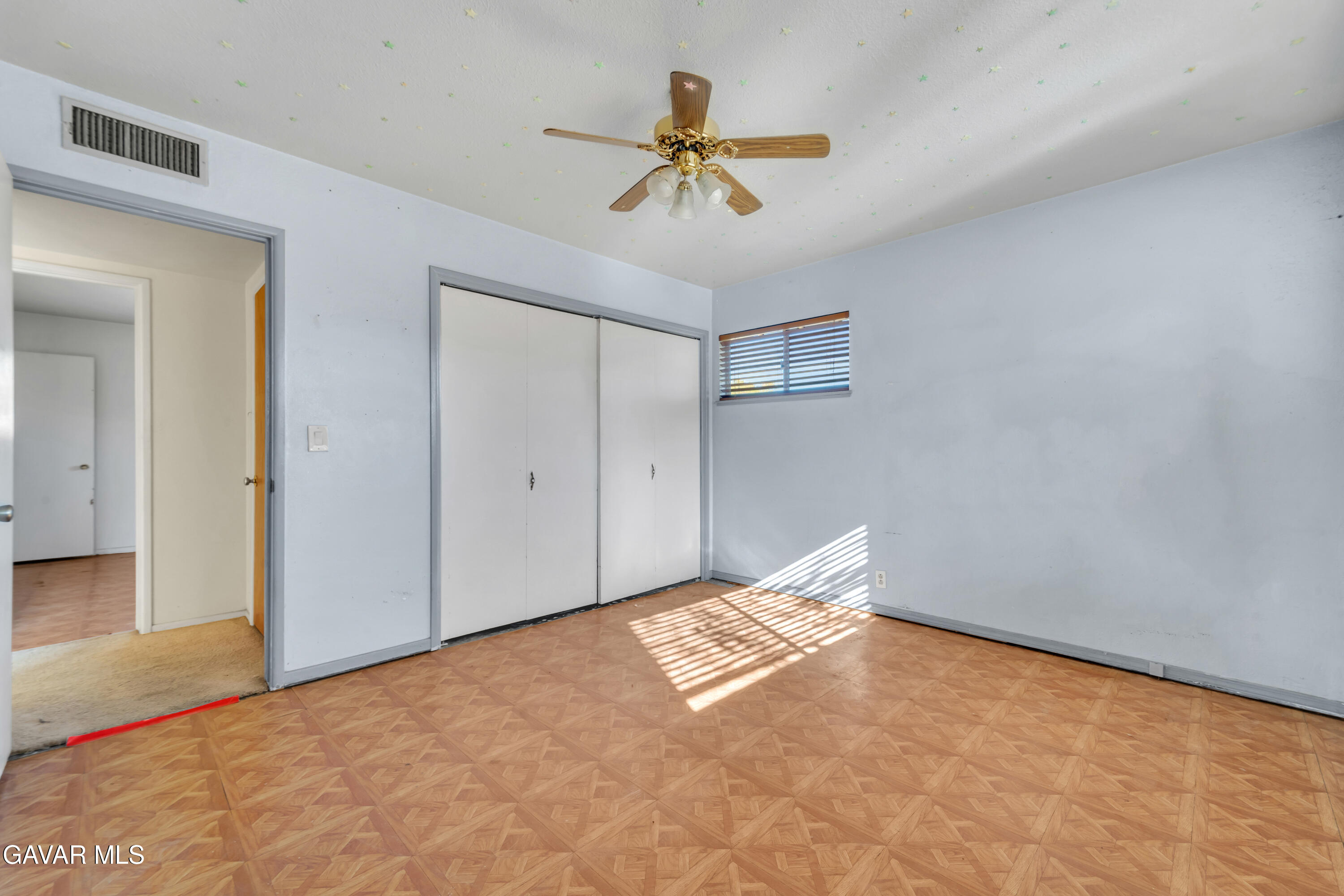 41522 Rimfield Avenue Lancaster, CA 93536 - Photo 9 of 15 a view of room with ceiling fan