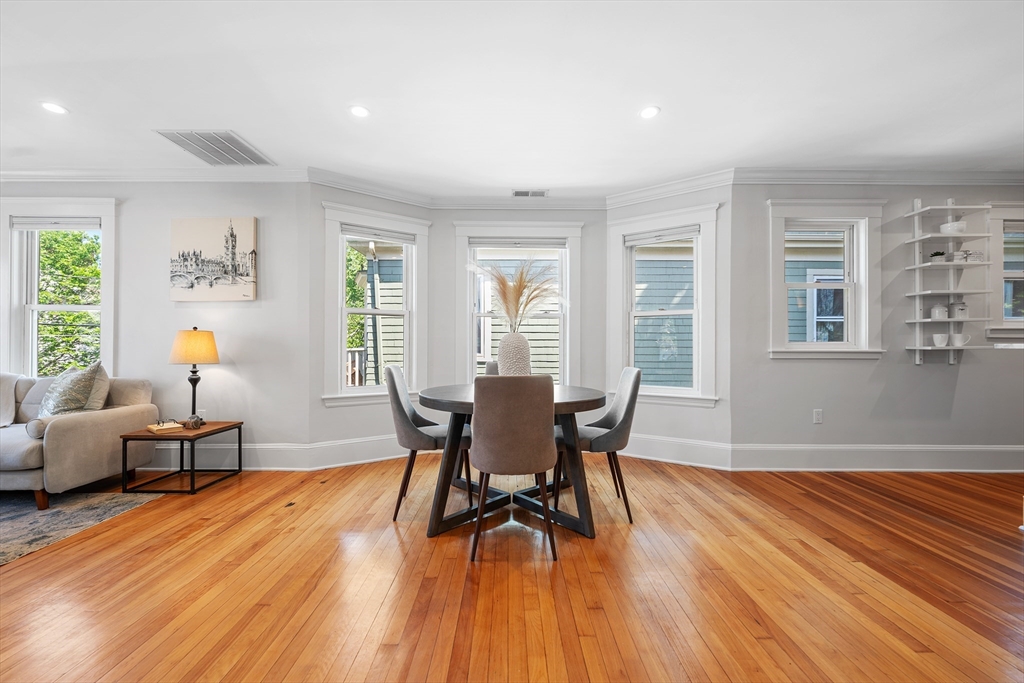 24 Jackson Road, Unit 2 Somerville, MA 02145 - Photo 13 of 35 a view of a dining room with furniture window and wooden floor