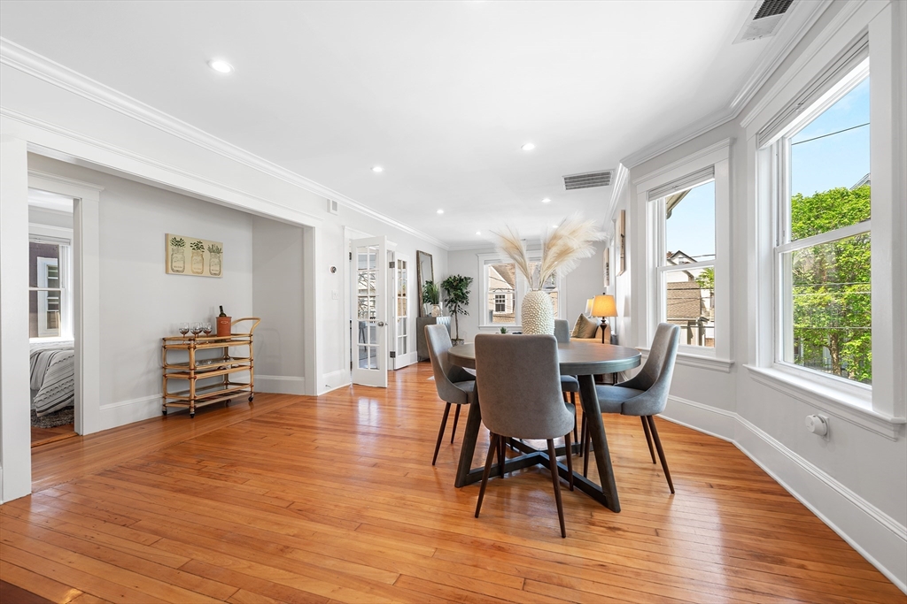 24 Jackson Road, Unit 2 Somerville, MA 02145 - Photo 14 of 35 a view of a dining room with furniture and wooden floor