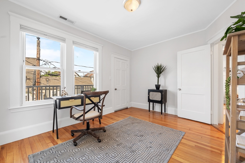 24 Jackson Road, Unit 2 Somerville, MA 02145 - Photo 16 of 35 a living room with furniture and a window