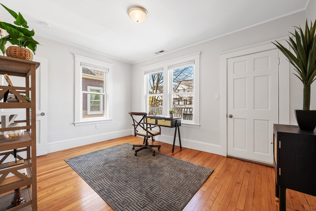 24 Jackson Road, Unit 2 Somerville, MA 02145 - Photo 17 of 35 a view of a livingroom with furniture and a window