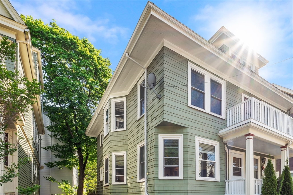 24 Jackson Road, Unit 2 Somerville, MA 02145 - Photo 2 of 35 a view of a house with a yard