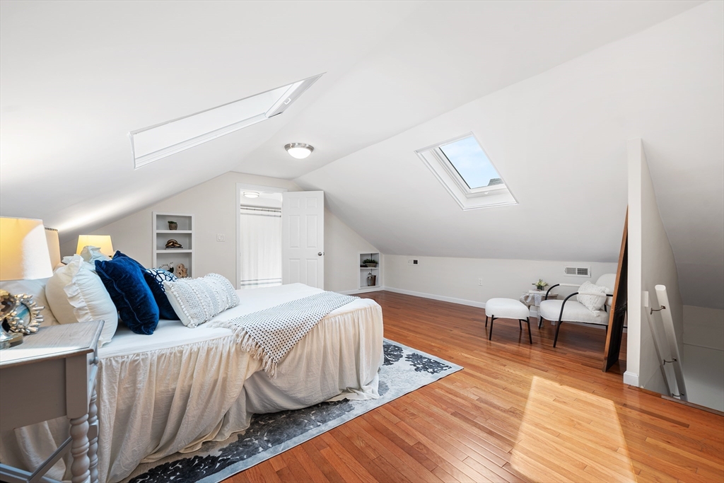 24 Jackson Road, Unit 2 Somerville, MA 02145 - Photo 23 of 35 a bedroom with a bed and wooden floor