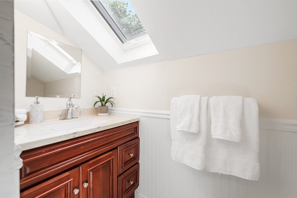 24 Jackson Road, Unit 2 Somerville, MA 02145 - Photo 25 of 35 a bathroom with a sink and a mirror
