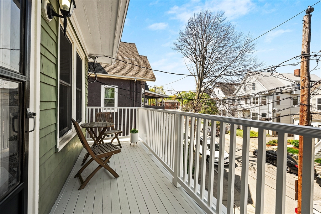24 Jackson Road, Unit 2 Somerville, MA 02145 - Photo 30 of 35 a view of a balcony with chairs