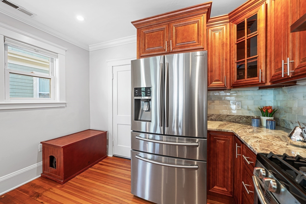 24 Jackson Road, Unit 2 Somerville, MA 02145 - Photo 10 of 35 a kitchen with stainless steel appliances granite countertop a refrigerator and a sink