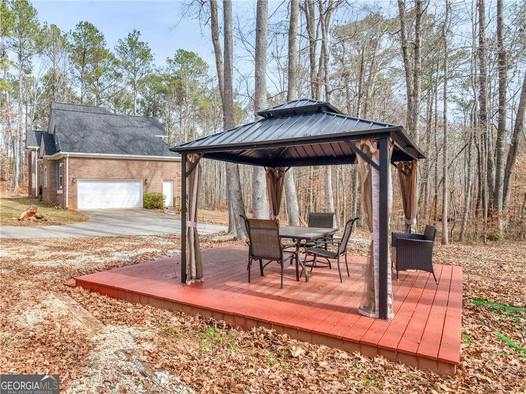 355 Parker Road Covington, GA 30014 - Photo 53 of 60 a view of outdoor space yard deck patio and outdoor kitchen