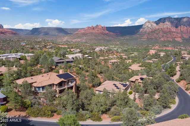 an aerial view of residential houses with outdoor space