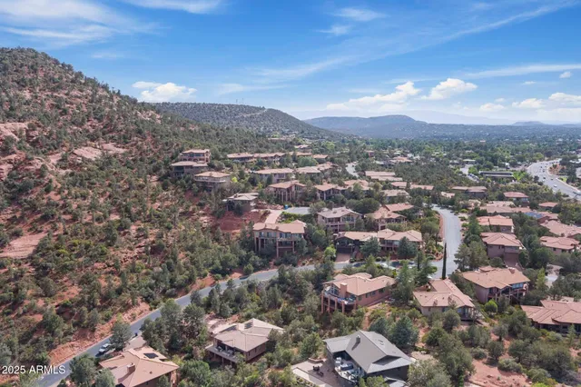an aerial view of residential houses with outdoor space