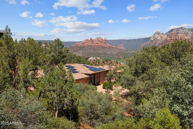 a view of a house with a tree