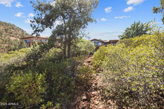 a view of a backyard with sitting area
