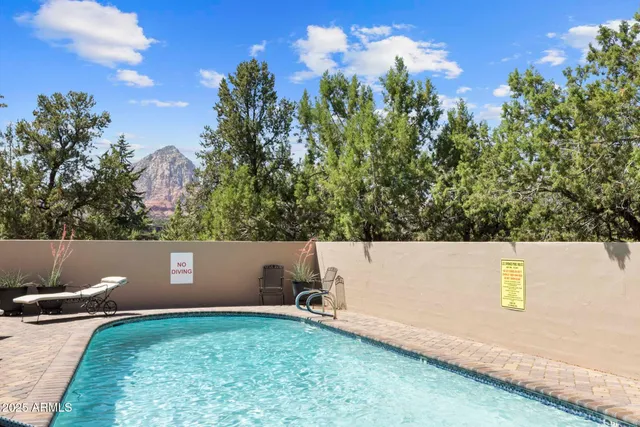 an aerial view of a residential houses with city view