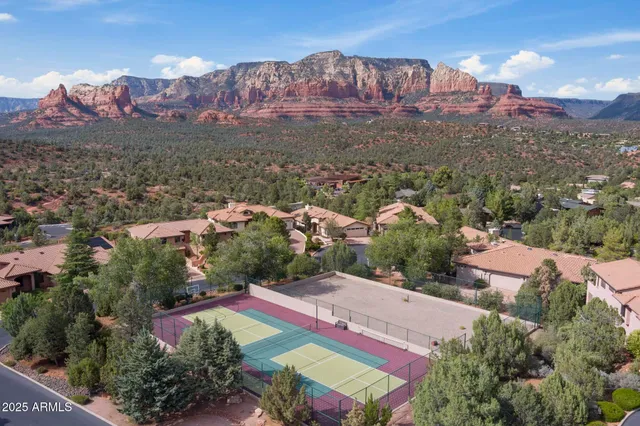 a view of a patio with table and chairs and potted plants