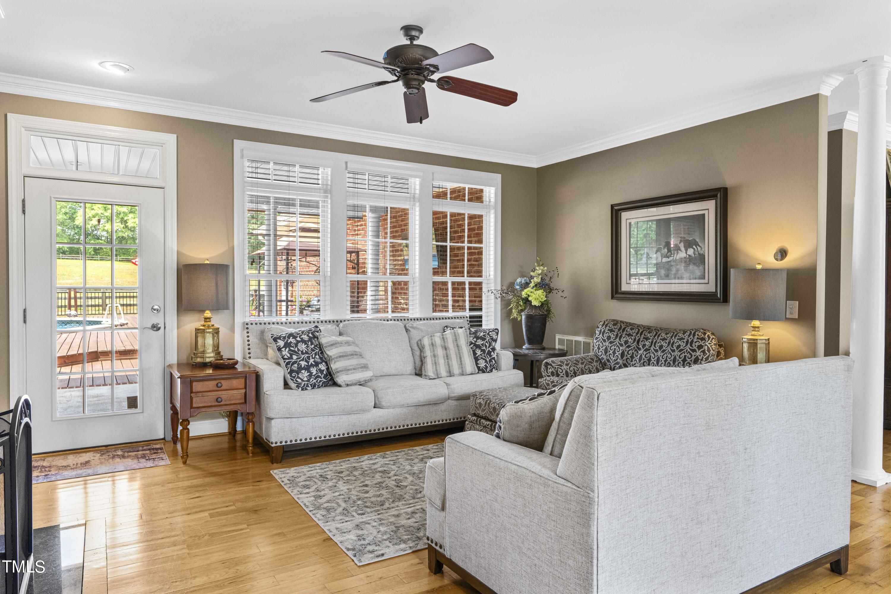 115 Three M Trail Benson, NC 27504 - Photo 12 of 80 a living room with furniture and a large window