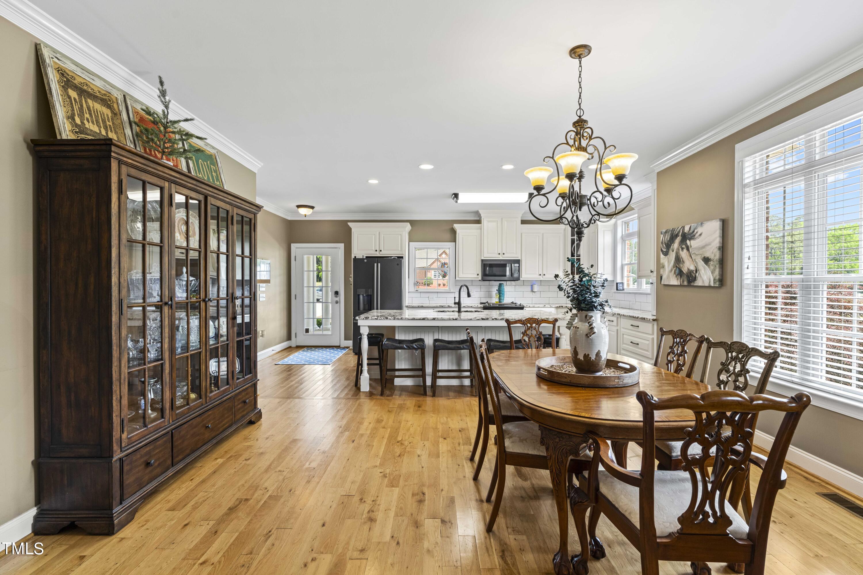 115 Three M Trail Benson, NC 27504 - Photo 18 of 80 a view of a dining room with furniture window and wooden floor