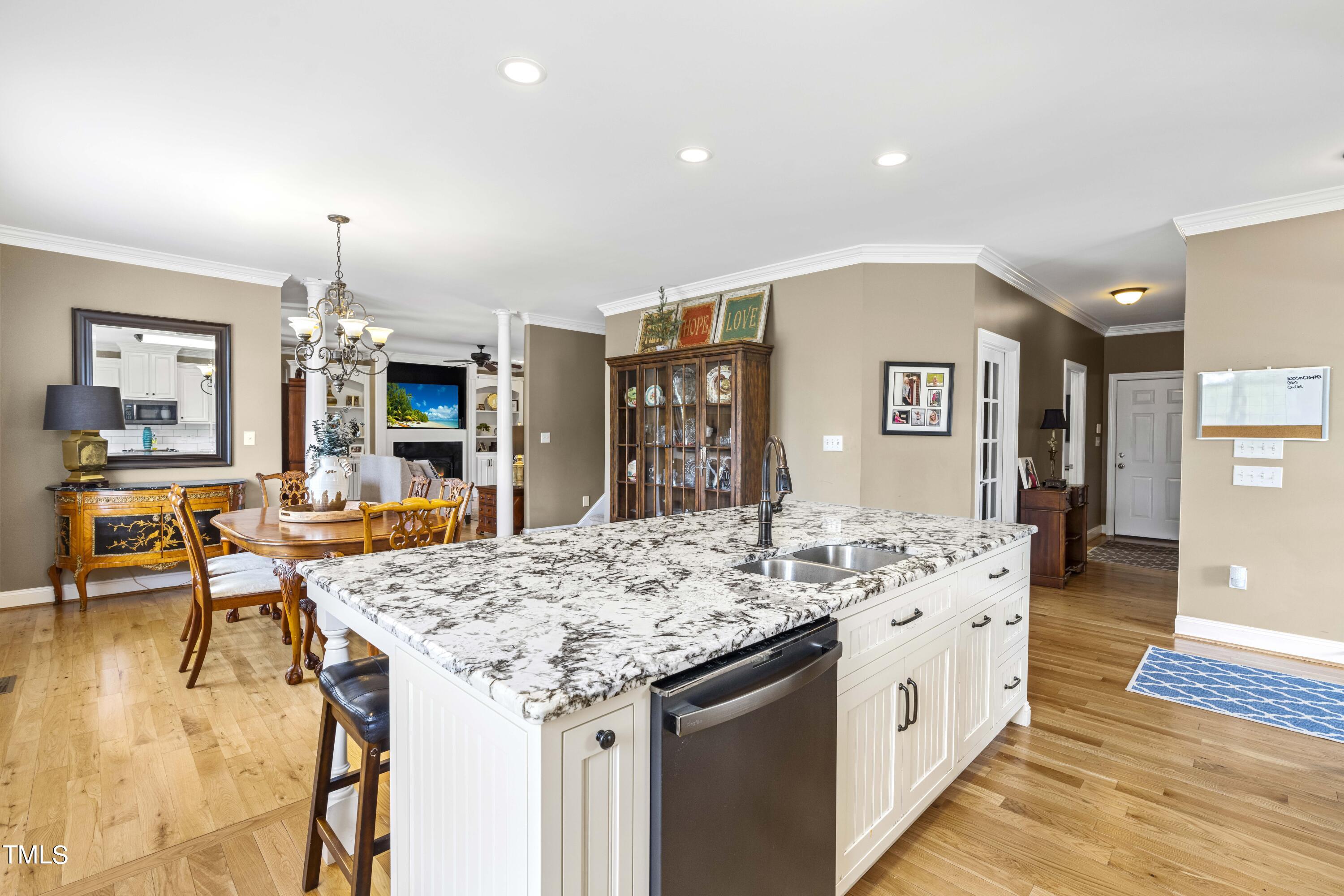 115 Three M Trail Benson, NC 27504 - Photo 21 of 80 a view of kitchen island kitchen island dining table and chairs