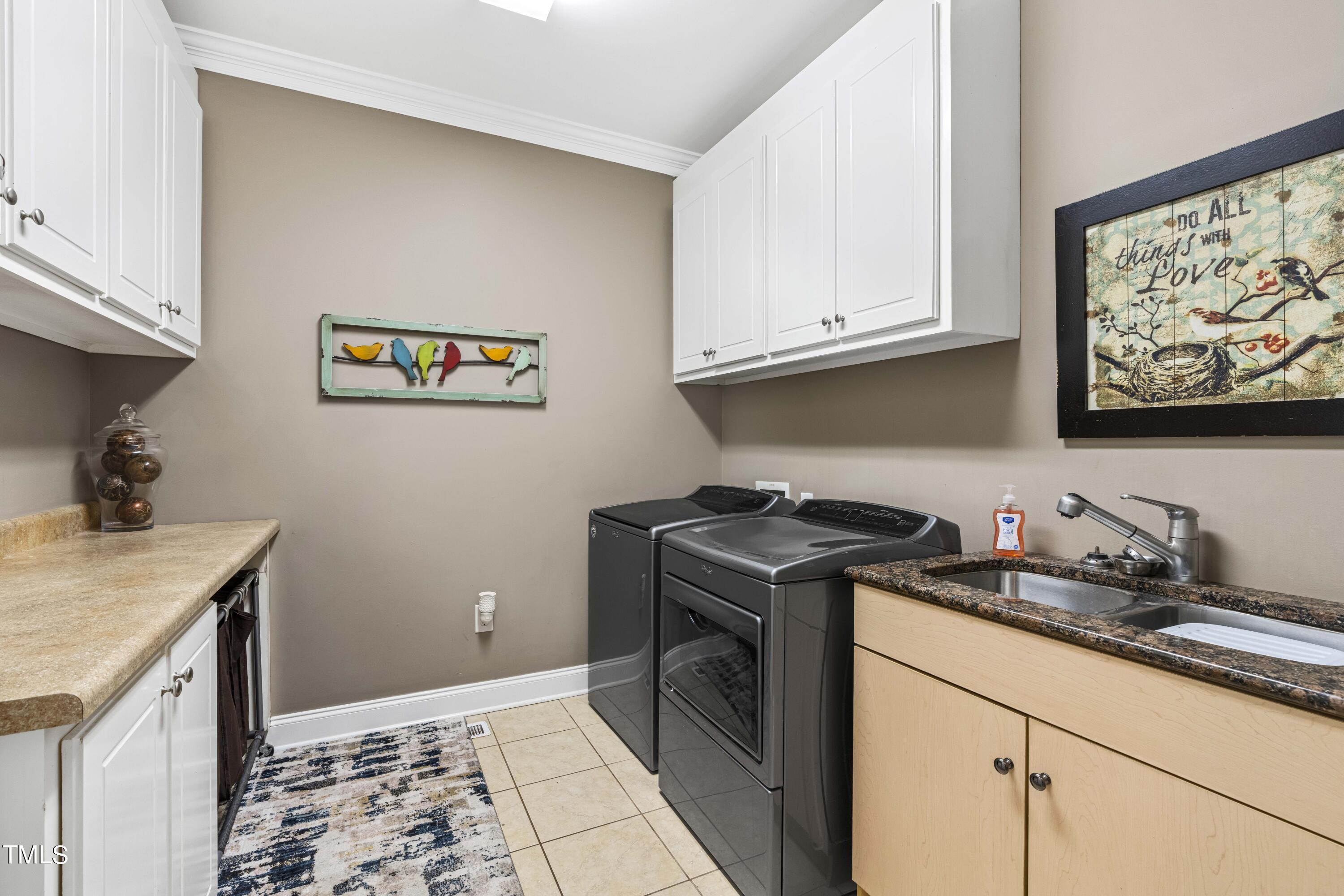 115 Three M Trail Benson, NC 27504 - Photo 23 of 80 a kitchen with stainless steel appliances granite countertop a stove a sink and a microwave