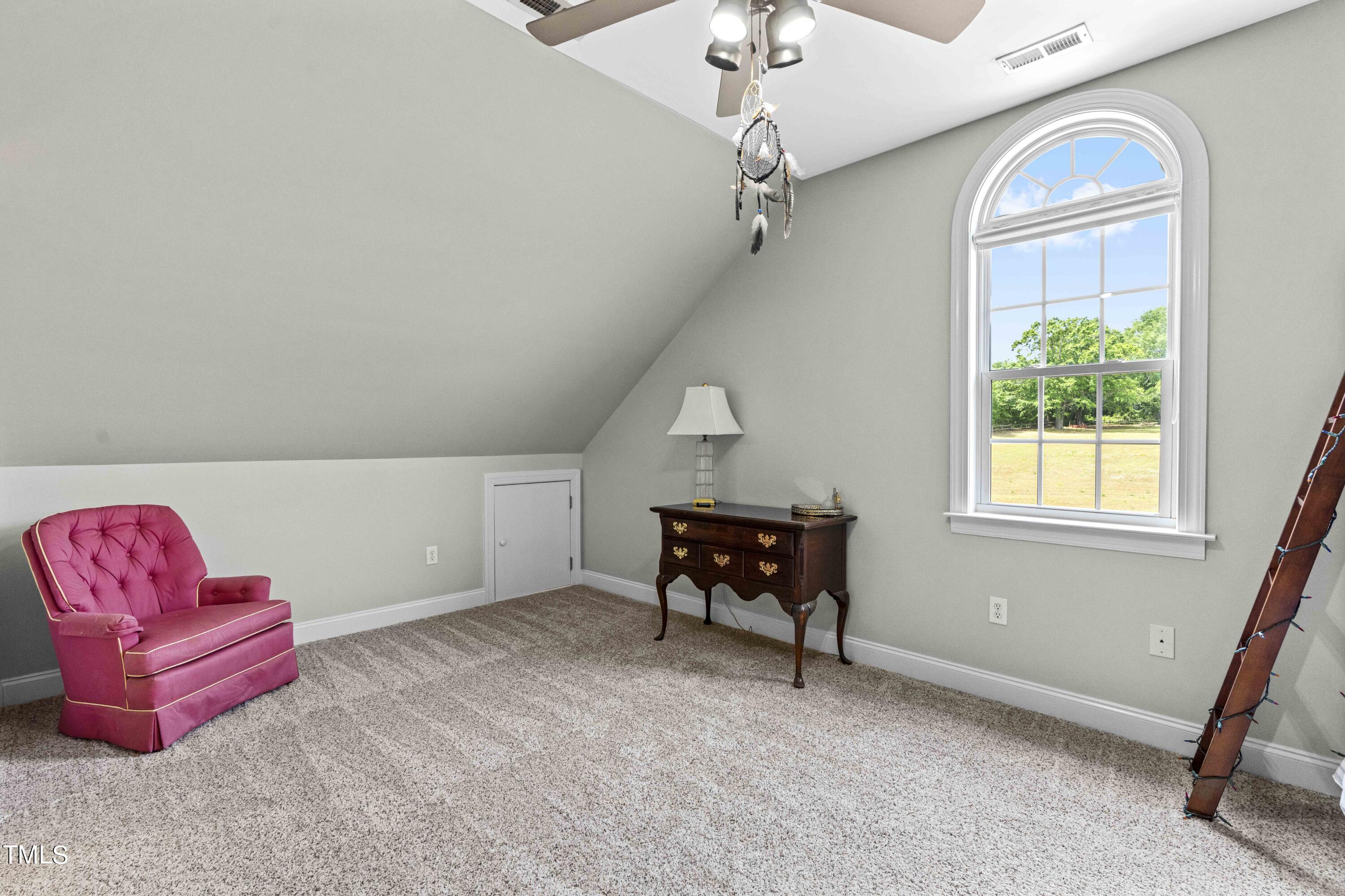 115 Three M Trail Benson, NC 27504 - Photo 33 of 80 a view of livingroom with furniture and a chandelier
