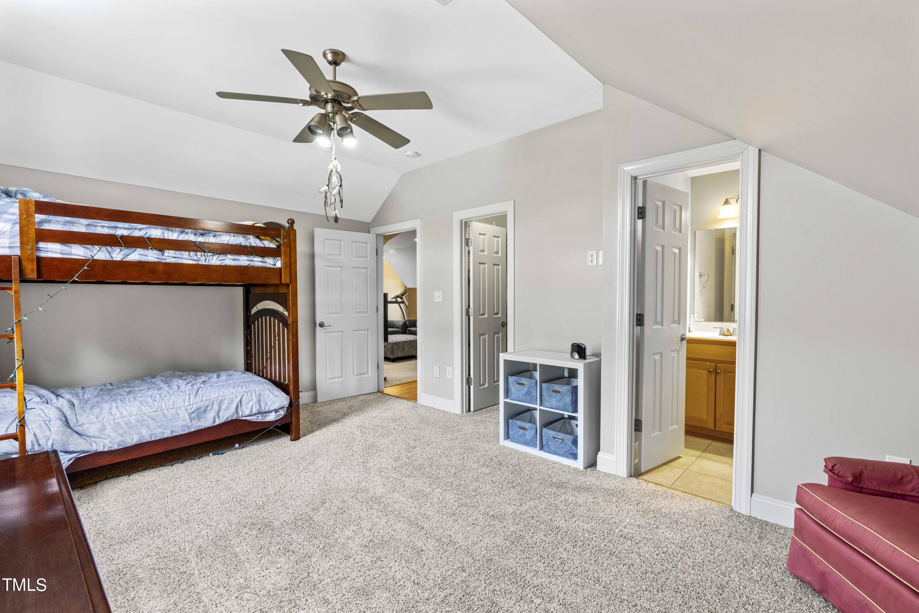 115 Three M Trail Benson, NC 27504 - Photo 34 of 80 a bedroom with furniture and a ceiling fan