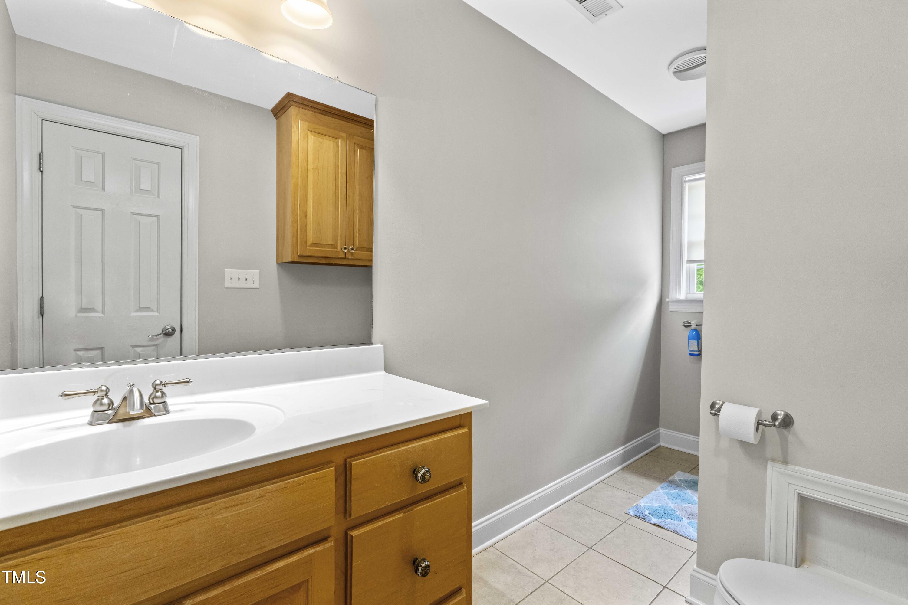 115 Three M Trail Benson, NC 27504 - Photo 35 of 80 a bathroom with a sink and a mirror