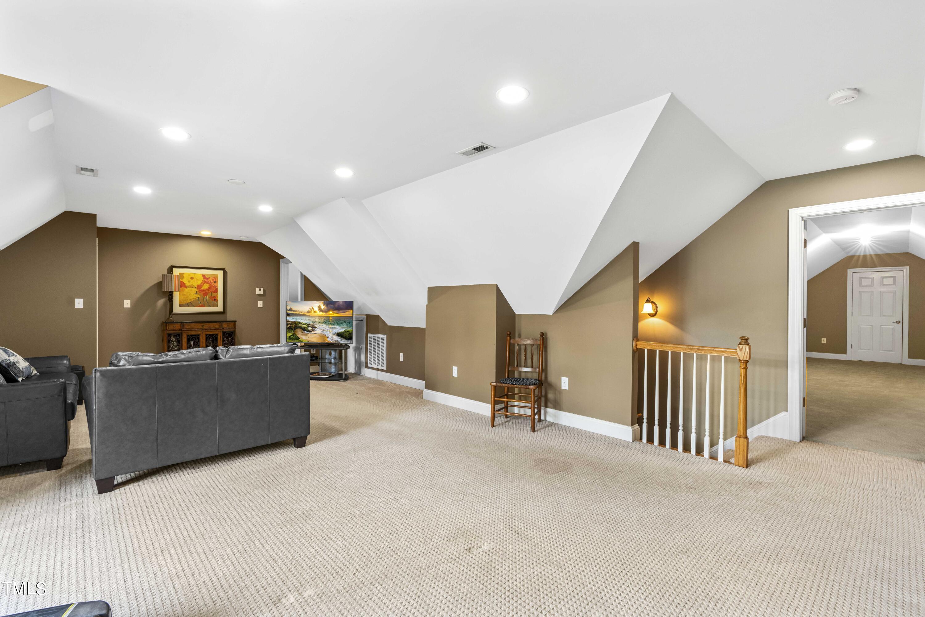 115 Three M Trail Benson, NC 27504 - Photo 37 of 80 a living room with furniture and a flat screen tv
