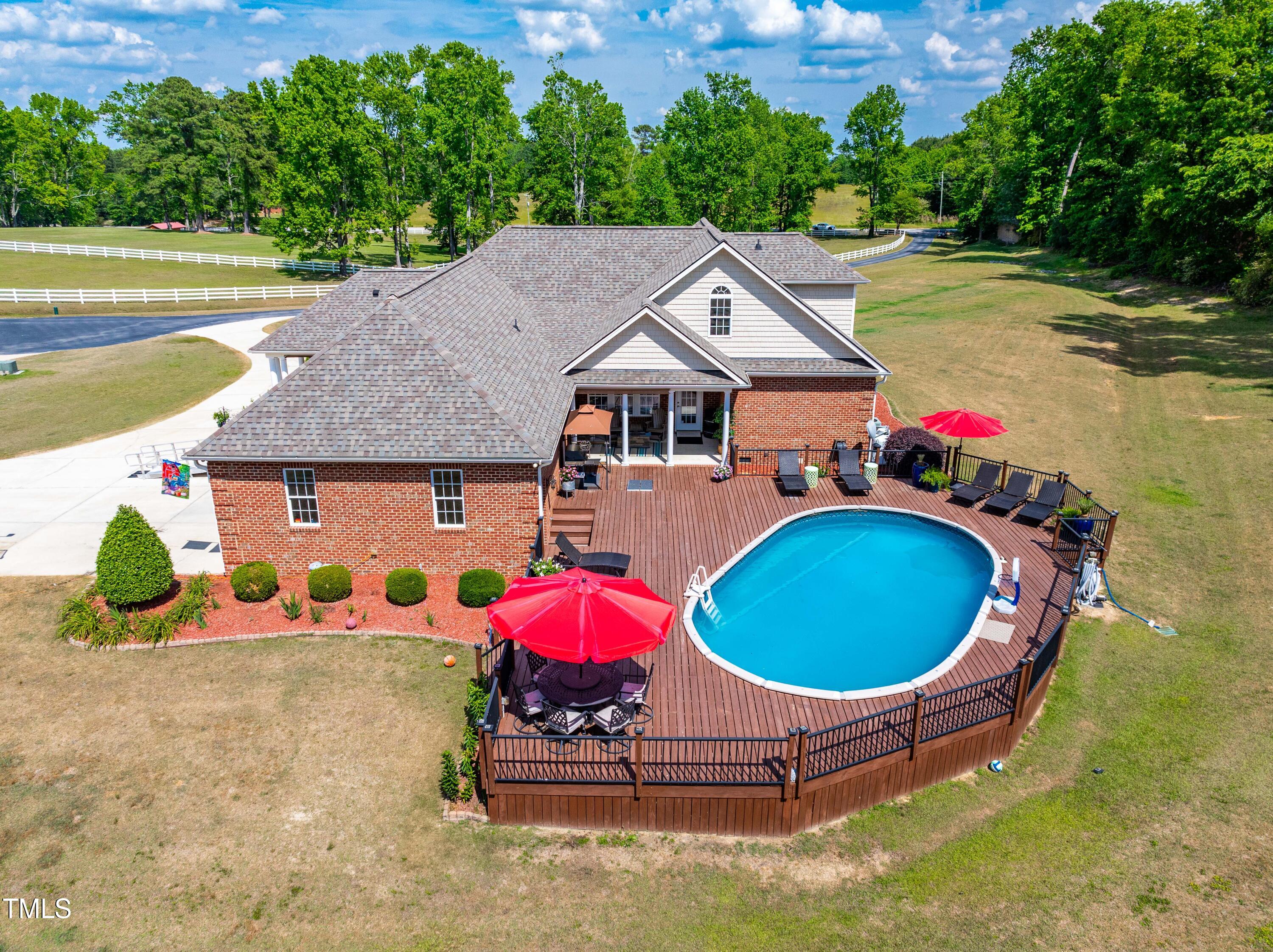 115 Three M Trail Benson, NC 27504 - Photo 47 of 80 an aerial view of a house with swimming pool and patio