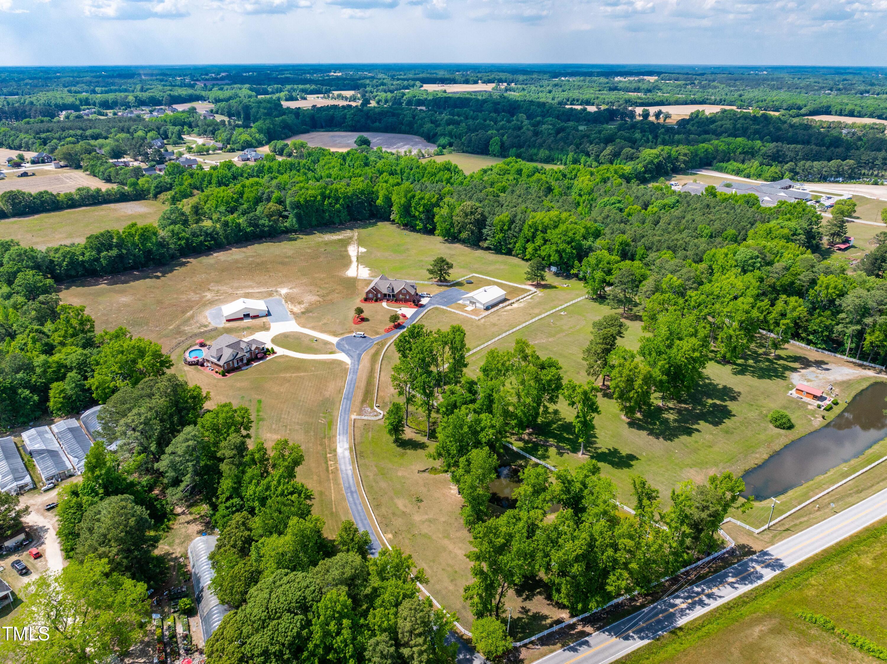 115 Three M Trail Benson, NC 27504 - Photo 67 of 80 an aerial view of a residential houses with outdoor space and trees all around
